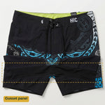 HIC Kanaha board shorts laid flat with the gusset panel outlined: a separate band of black fabric sewn across the crotch