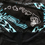 Close-up of the HIC Kanaha pocket flap with the Hawaiian island chain embroidered in white thread